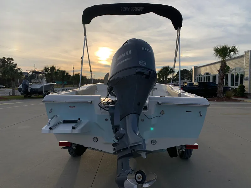 Slide: The Image of 2024 Key West 179 FS boat with Yamaha engine at sunset. - 3