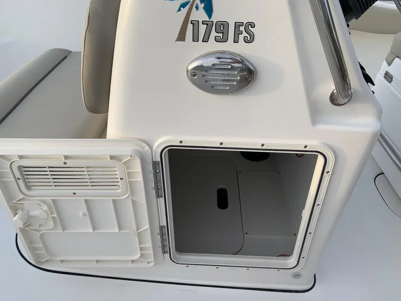 Slide: The Image of 2024 Key West 179 FS boat storage compartment with open hatch. - 6
