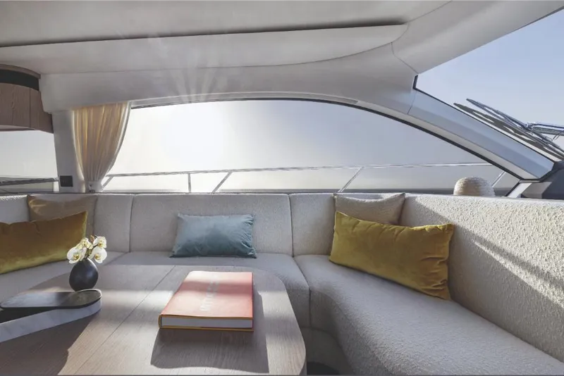Slide: The Image of Luxurious interior of 2023 Azimut 53 yacht with elegant seating and panoramic windows. - 11