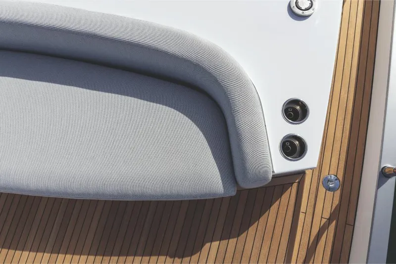 Slide: The Image of Close-up of 2023 Azimut 53 yacht's deck with cushioned seating. - 12