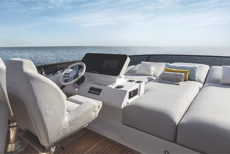 Slide: The Image of 2023 Azimut 53 yacht helm and sunbathing area with ocean view. - 15