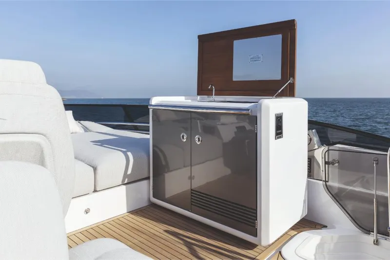 Slide: The Image of Outdoor kitchenette on the 2023 Azimut 53 yacht with ocean view. - 16