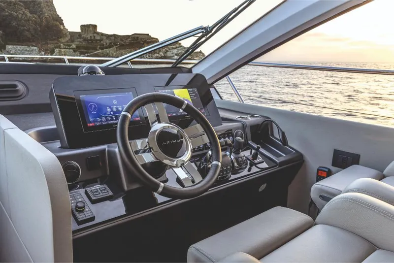Slide: The Image of 2023 Azimut 53 yacht helm with modern navigation system and ocean view. - 22