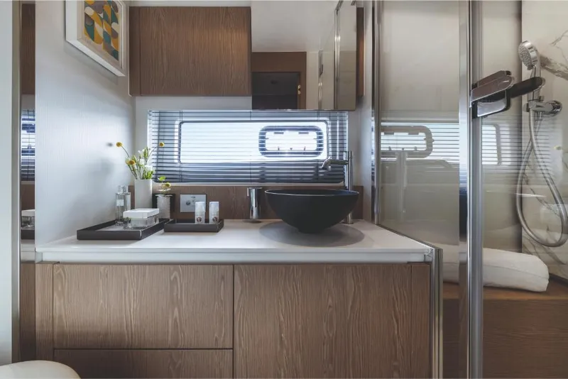 Slide: The Image of Modern bathroom in 2023 Azimut 53 yacht with sleek design and luxury amenities. - 23