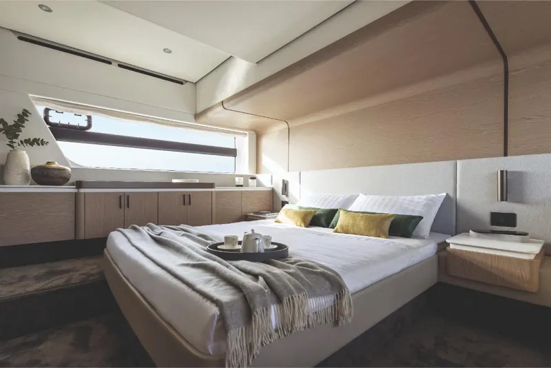 Slide: The Image of Luxurious bedroom interior of 2023 Azimut 53 yacht with modern decor and large window. - 24