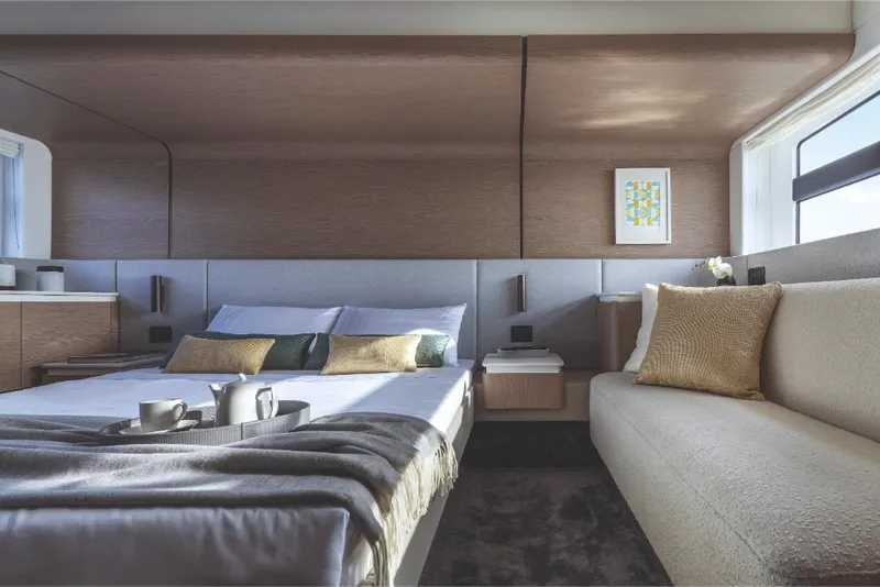 Slide: The Image of Luxurious bedroom interior of 2023 Azimut 53 yacht with modern decor and natural light. - 25