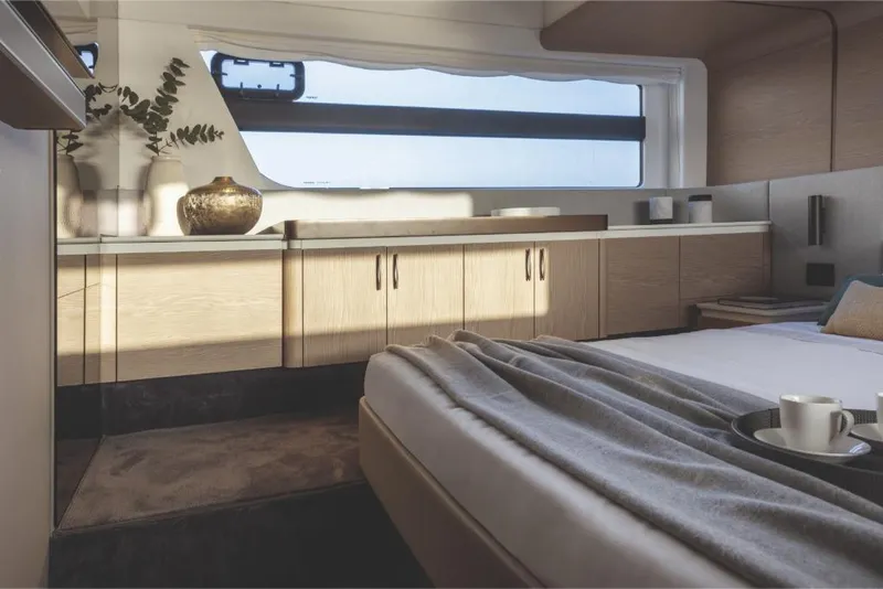 Slide: The Image of Luxurious bedroom interior of 2023 Azimut 53 yacht with modern decor and natural light. - 28