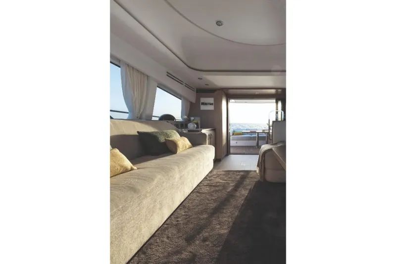 Slide: The Image of Interior of 2023 Azimut 53 yacht with modern furnishings and ocean view. - 32