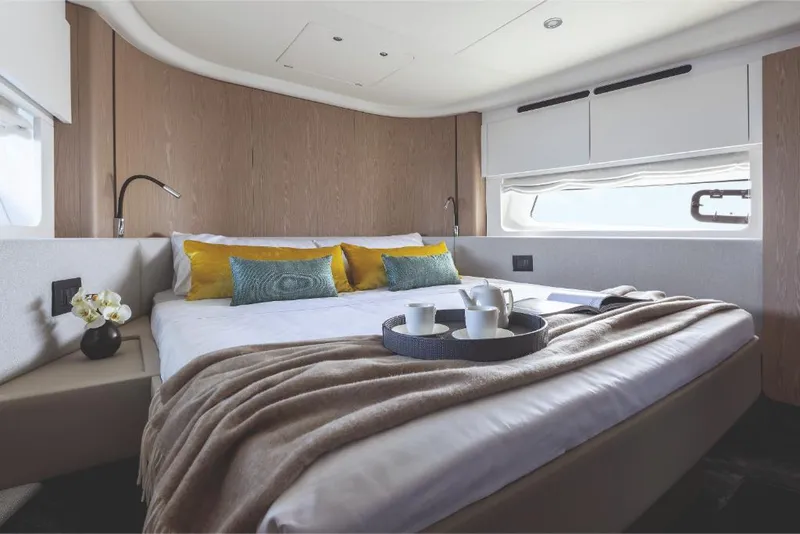 Slide: The Image of Luxurious bedroom interior of 2023 Azimut 53 yacht with cozy bedding and modern decor. - 33
