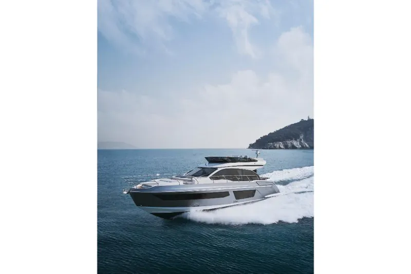 Slide: The Image of 2023 Azimut 53 yacht cruising on open water. - 38