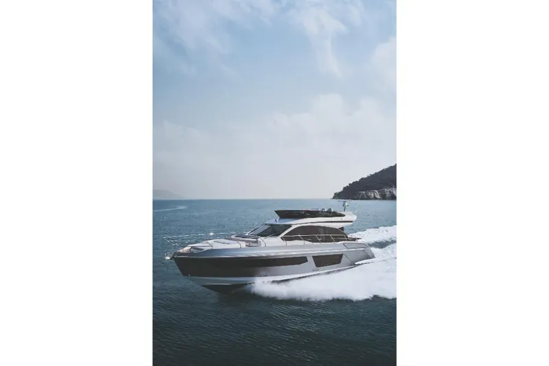 Slide: The Image of 2023 Azimut 53 yacht cruising on open water. - 39