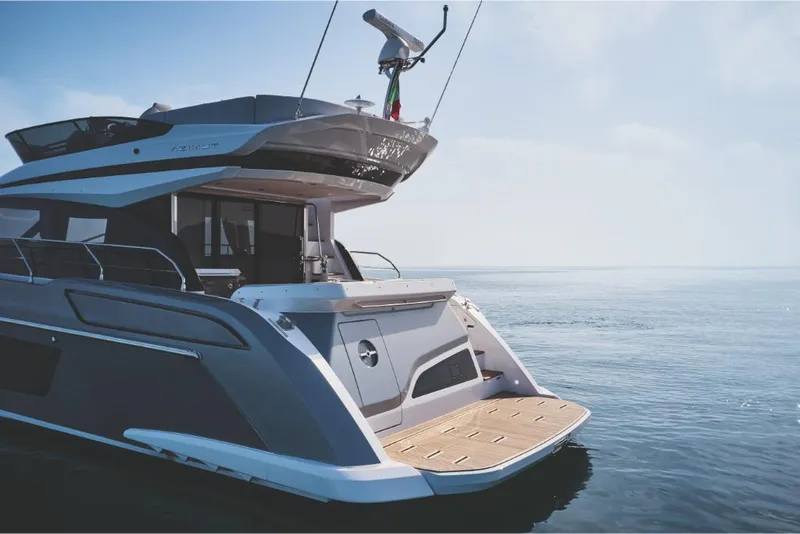 Slide: The Image of 2023 Azimut 53 yacht on calm waters, rear view. - 7