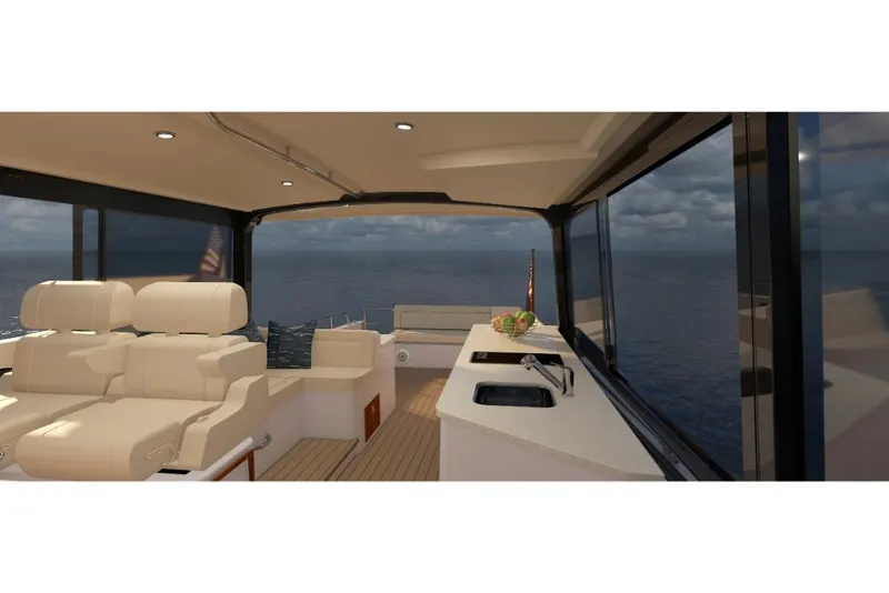 Slide: The Image of Interior of 2023 MJM 4 yacht with ocean view, featuring luxurious seating and kitchenette. - 5
