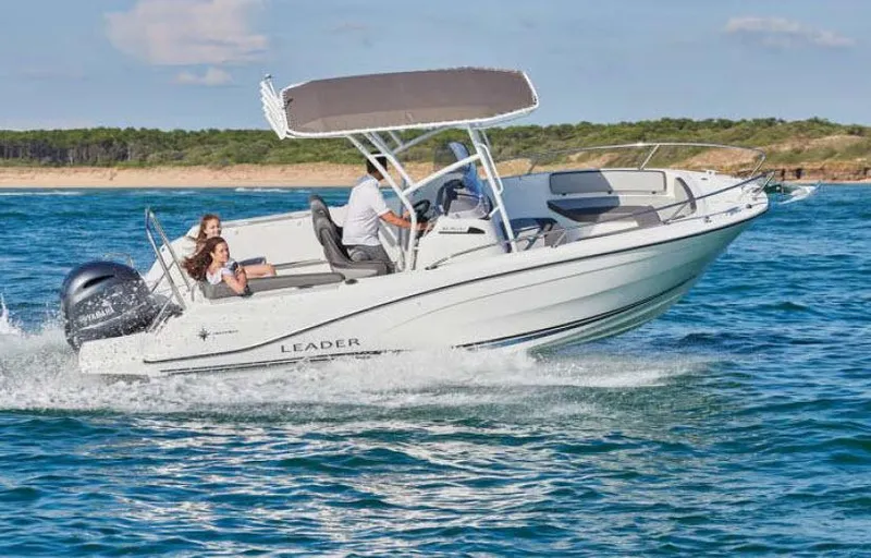 The Image of 2023 Jeanneau Leader 6.5 S3 CC boat cruising on open water. - 1