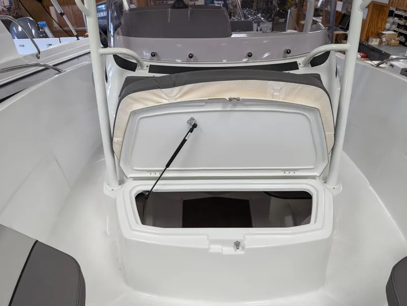 Slide: The Image of 2023 Jeanneau Leader 6.5 S3 CC boat with open storage compartment. - 7