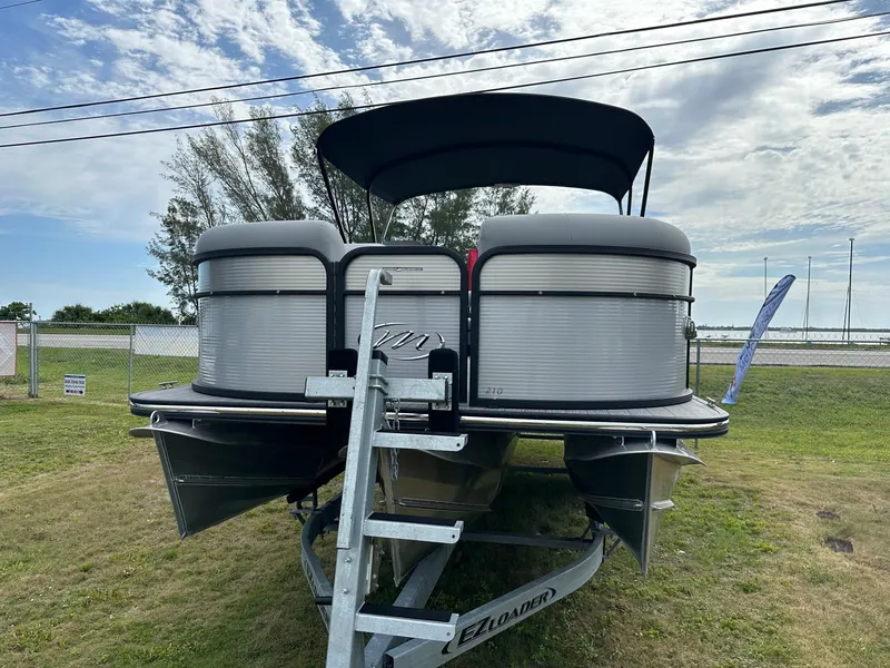 Slide: The Image of 2022 Manitou Oasis 21 RF VP pontoon boat on trailer, front view. - 1