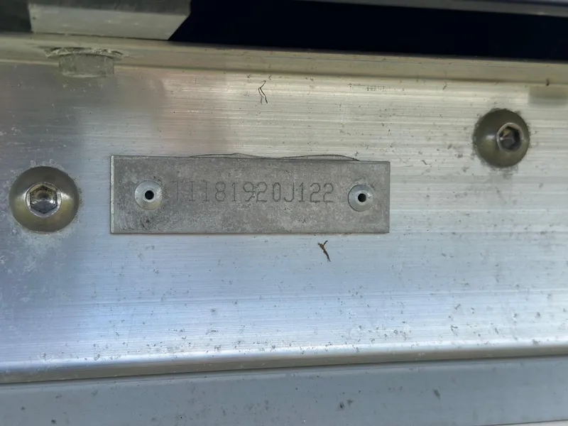 Slide: The Image of 2022 Manitou Oasis 21 RF VP serial number plate on aluminum surface. - 21