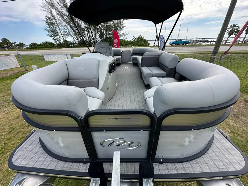 Slide: The Image of 2022 Manitou Oasis 21 RF VP pontoon boat with spacious seating and canopy. - 9