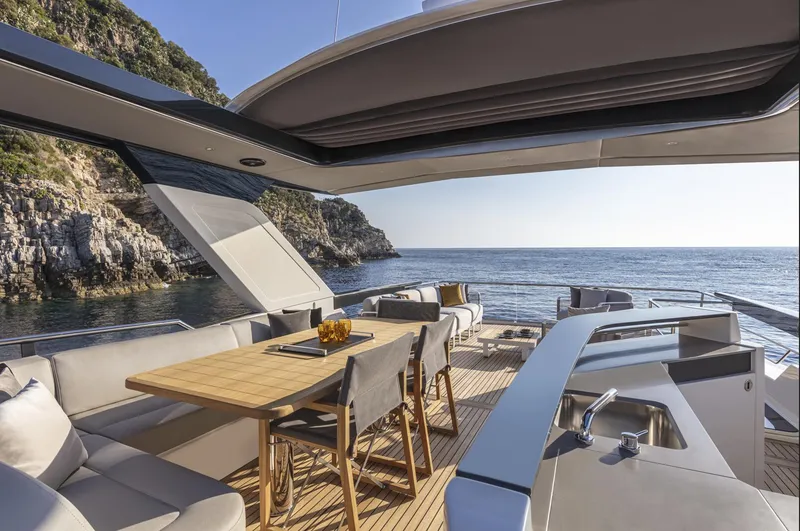 Slide: The Image of Luxurious 2025 Absolute Navetta 64 yacht deck with elegant seating and ocean view. - 10