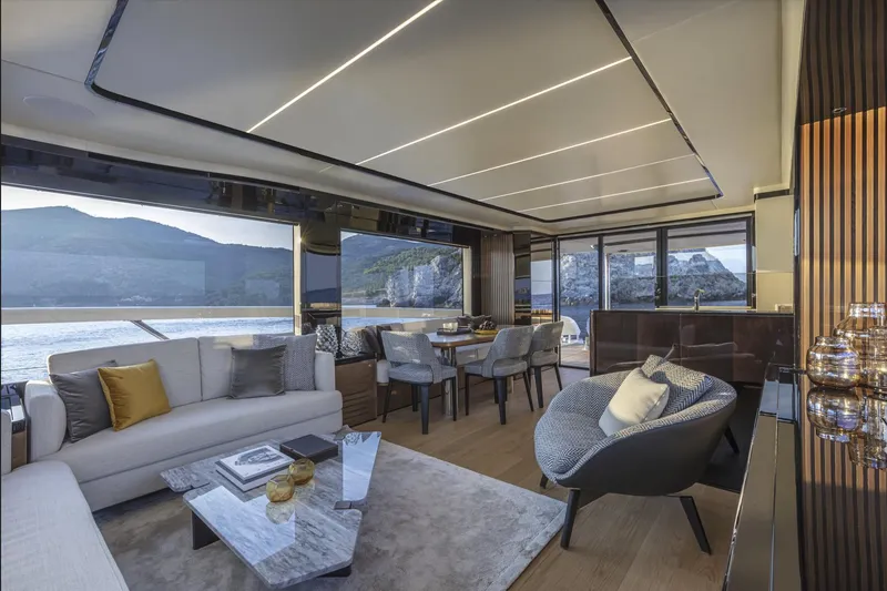 Slide: The Image of Luxurious interior of 2025 Absolute Navetta 64 yacht with modern furnishings and scenic views. - 12