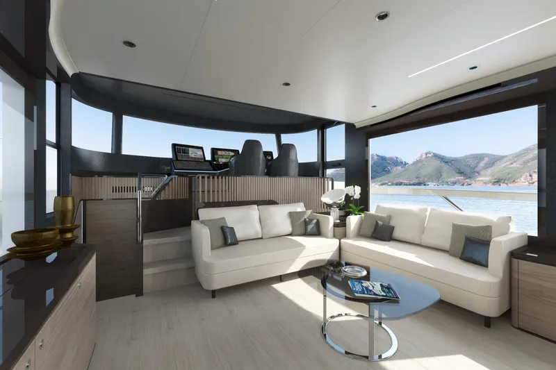 Slide: The Image of Luxurious interior of the 2025 Absolute Navetta 64 yacht with scenic ocean view. - 14