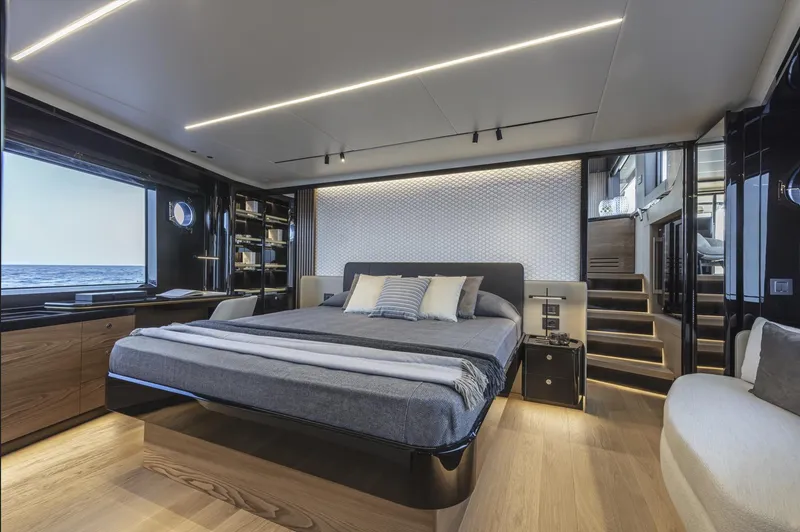 Slide: The Image of Luxurious bedroom interior of 2025 Absolute Navetta 64 yacht with modern design and ocean view. - 15