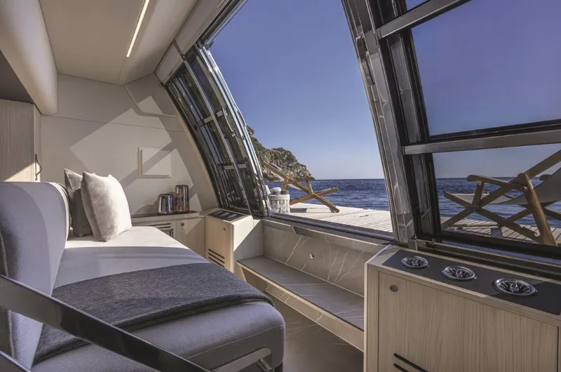 Slide: The Image of Luxurious interior of 2025 Absolute Navetta 64 yacht with ocean view. - 5