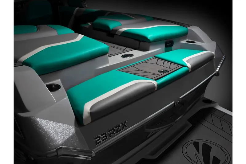 Slide: The Image of 2023 Tigé 24RZX boat with teal and gray seating. - 12