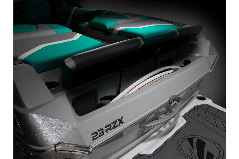 Slide: The Image of 2023 Tigé 24RZX boat interior with teal and gray seating. - 13
