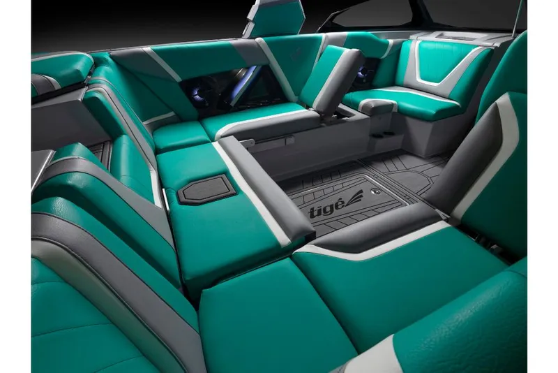 Slide: The Image of 2023 Tigé 24RZX boat interior with teal and gray seating. - 24