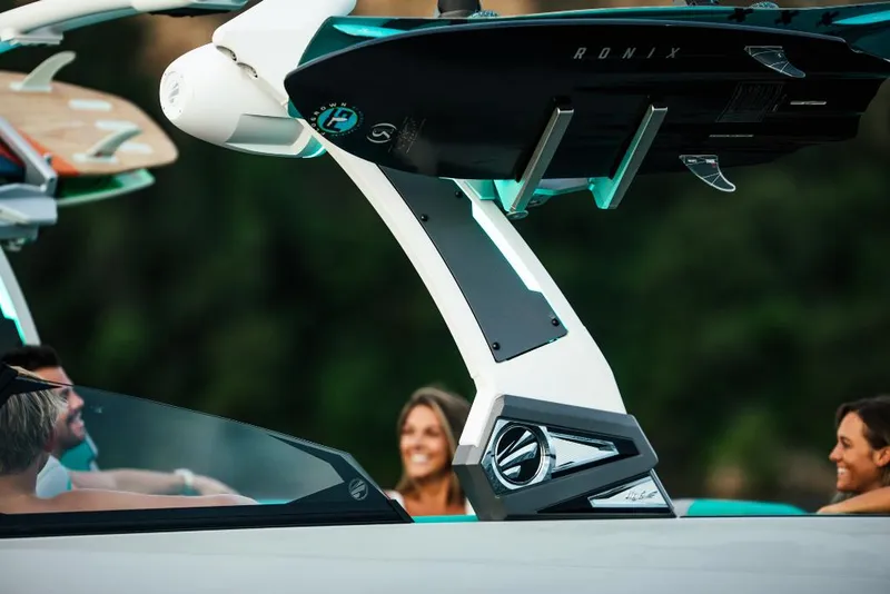 Slide: The Image of 2023 Tigé 24RZX boat with wakeboard rack and passengers. - 27