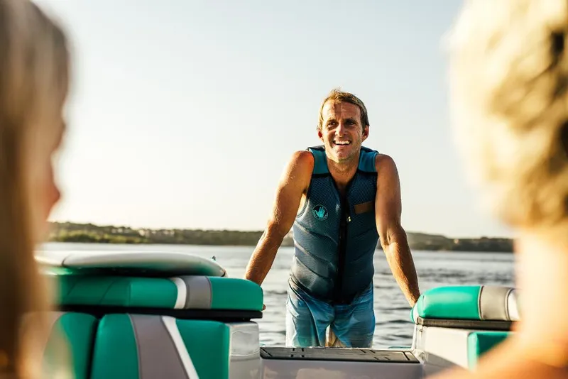 Slide: The Image of Man in a life vest on a 2023 Tigé 24RZX boat. - 41