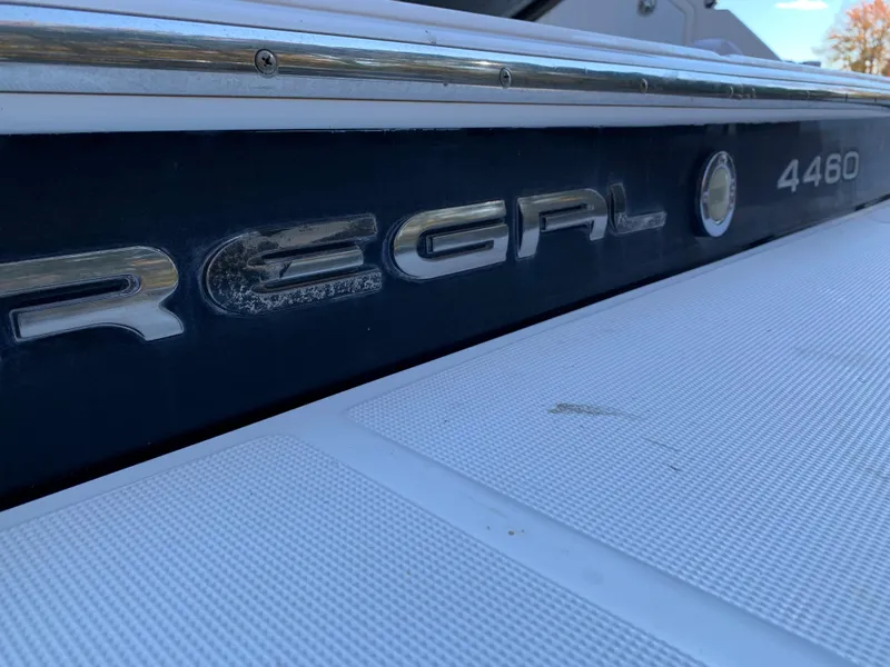 Slide: The Image of Close-up of a 2009 Regal 4460 boat nameplate. - 27