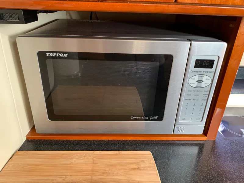 Slide: The Image of Stainless steel Tappan convection microwave in a 2009 Regal 4460 boat kitchen. - 36