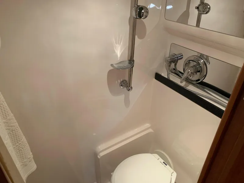 Slide: The Image of 2009 Regal 4460 yacht bathroom with shower and toilet. - 44