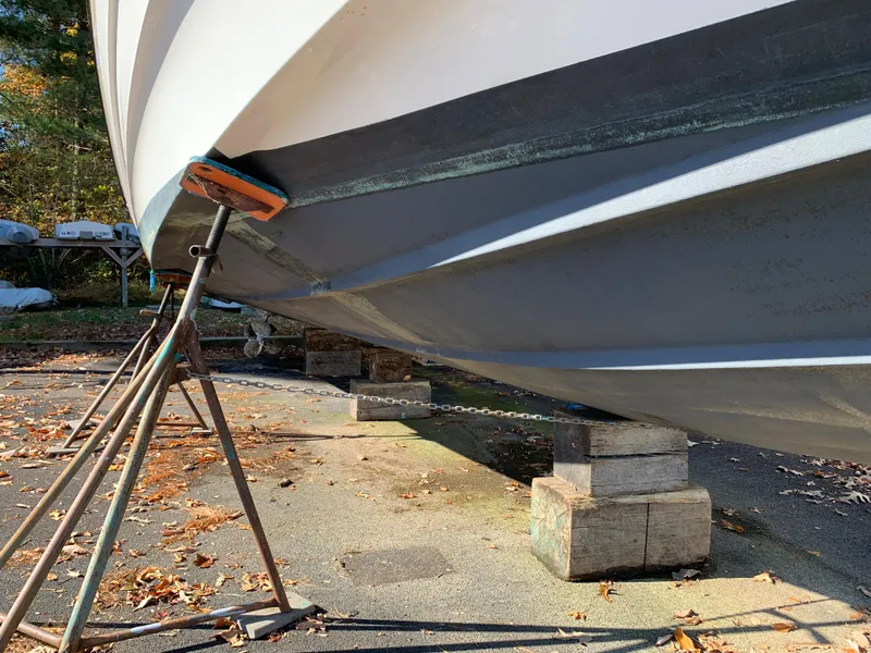 Slide: The Image of 2009 Regal 4460 boat on stands for maintenance. - 9
