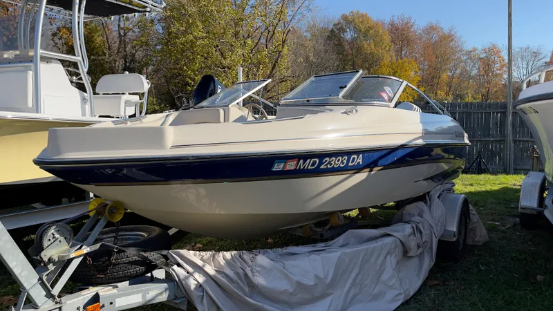 Slide: The Image of 2003 Glastron GX 180 Ski & Fish boat on a trailer, side view. - 11