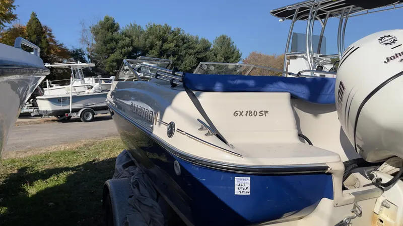 Slide: The Image of 2003 Glastron GX 180 Ski & Fish boat in a marina. - 13