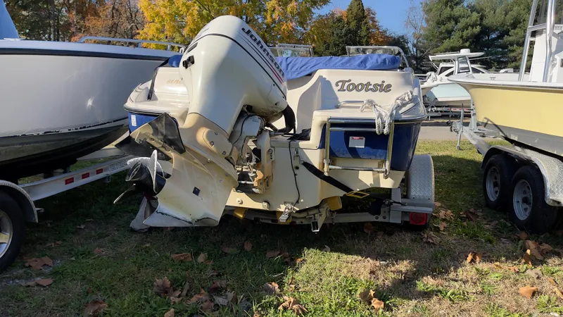 Slide: The Image of 2003 Glastron GX 180 Ski & Fish boat with outboard motor on grass. - 15