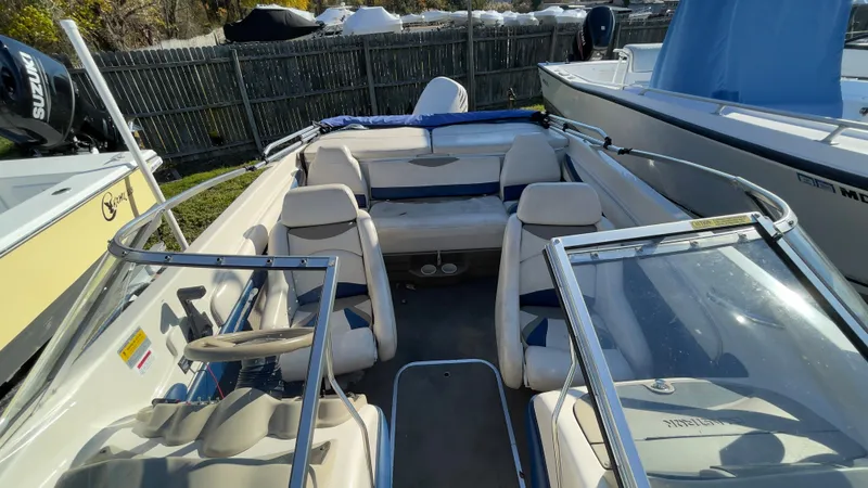 Slide: The Image of 2003 Glastron GX 180 Ski & Fish boat interior with seating and steering wheel. - 26