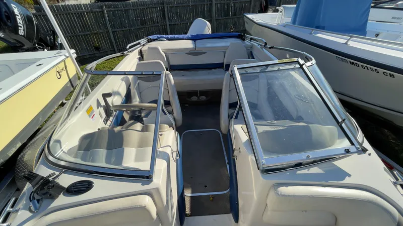 Slide: The Image of 2003 Glastron GX 180 Ski & Fish boat interior with seating and windshield. - 27