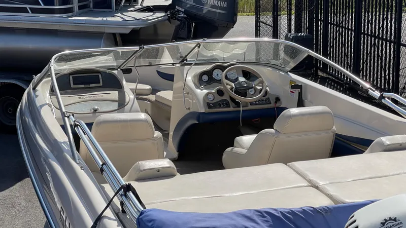 Slide: The Image of 2003 Glastron GX 180 Ski & Fish boat interior with steering wheel and seating. - 29