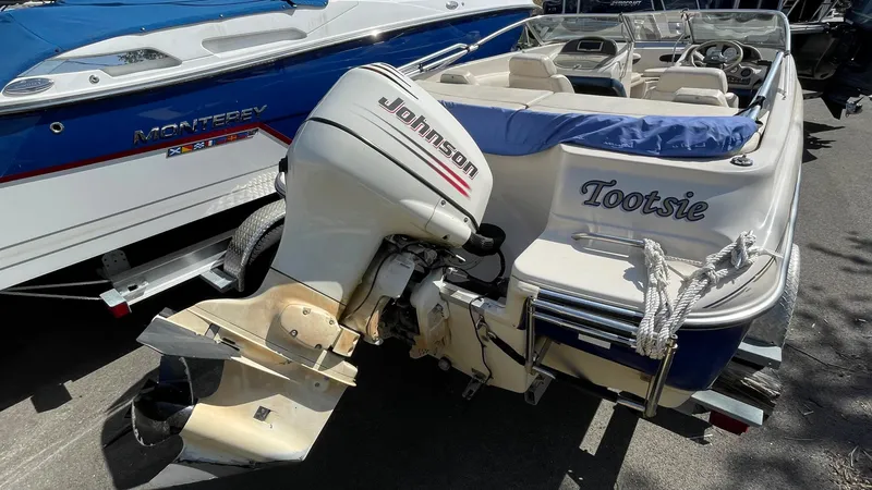 Slide: The Image of 2003 Glastron GX 180 Ski & Fish boat with Johnson outboard motor. - 30