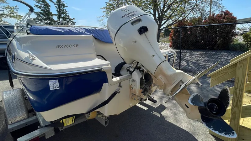 Slide: The Image of 2003 Glastron GX 180 Ski & Fish boat with outboard motor on trailer. - 31