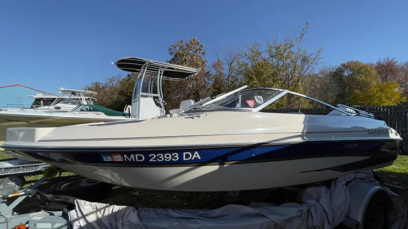 Slide: The Image of 2003 Glastron GX 180 Ski & Fish boat on trailer, side view. - 4