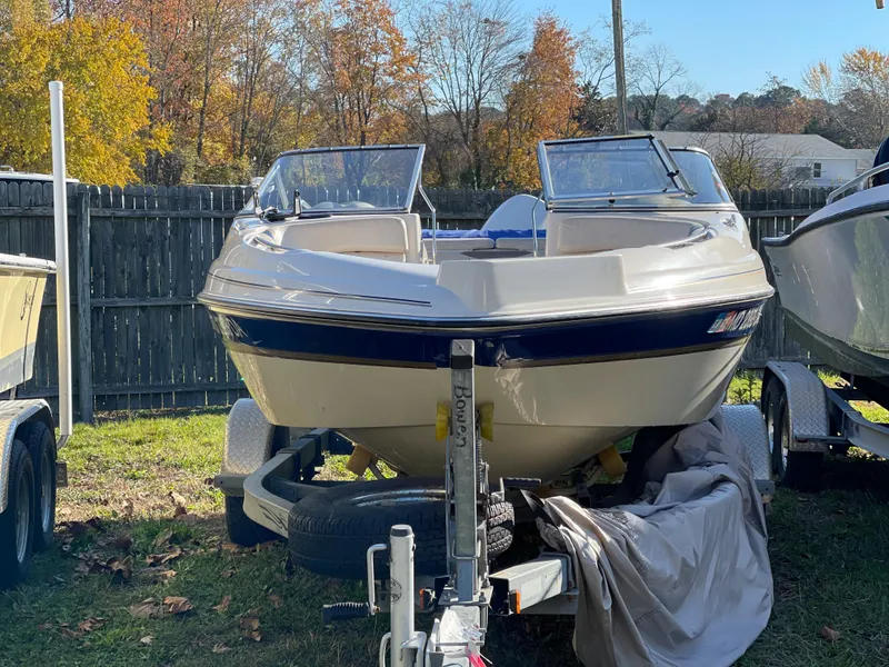 Slide: The Image of 2003 Glastron GX 180 Ski & Fish boat on trailer in outdoor storage. - 9