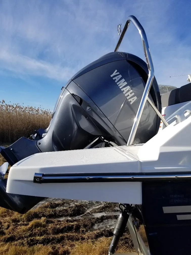 Slide: The Image of 2022 Jeanneau Leader 7.5 WA S3 with Yamaha outboard motor, side view. - 16