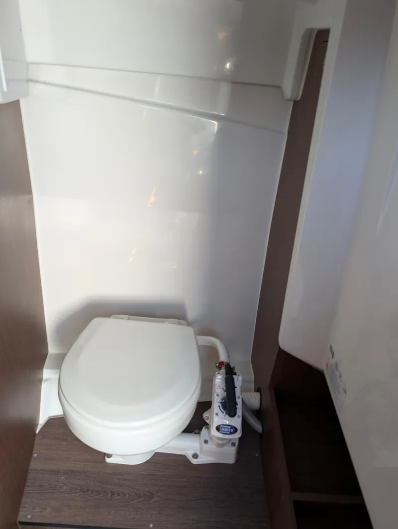 Slide: The Image of 2022 Jeanneau Leader 7.5 WA S3 boat bathroom with compact marine toilet. - 21