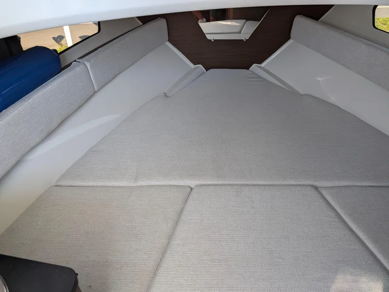 Slide: The Image of Interior cabin of 2022 Jeanneau Leader 7.5 WA S3 with cushioned seating. - 22