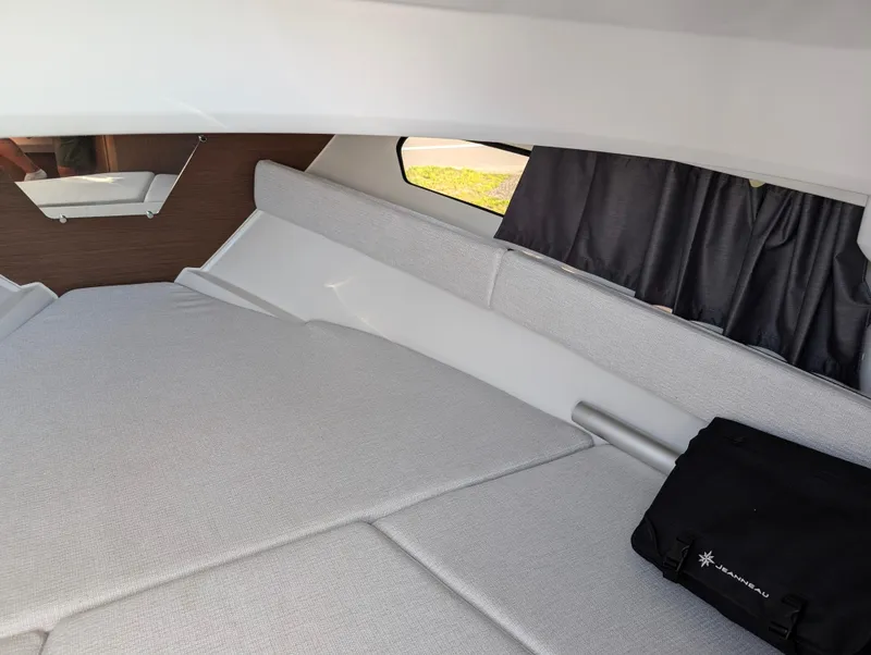 Slide: The Image of Interior cabin of 2022 Jeanneau Leader 7.5 WA S3 with cushioned seating and window. - 23